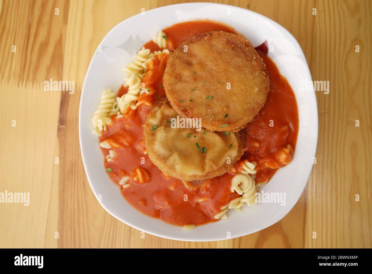 Original German Democratic Republic version of escalope chasseur with breaded Jagdwurst, noodles