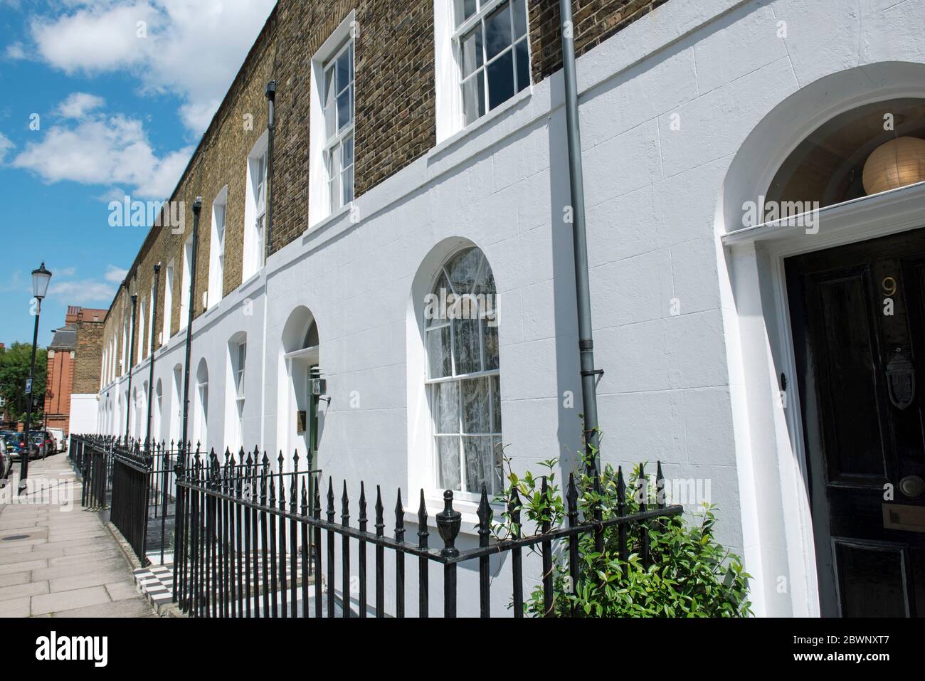 Terraced houses with railings St Luke's Street Royal London Borough of Kensington & Chelsea Stock Photo