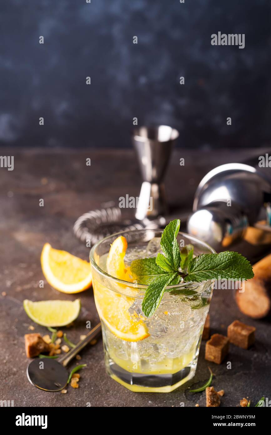 Mojito or Caipirinha cocktail. Brown sugar and an empty glass on stone Stock Photo