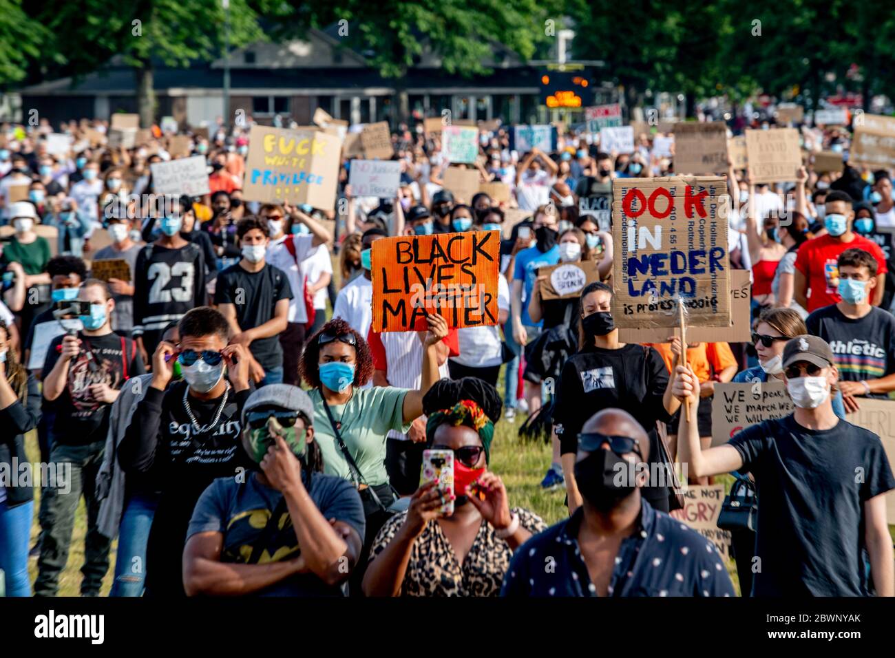 Thousand of protests are seen wearing facemasks at Malieveld in The Hague with protest placards Thousand of protests are seen wearing facemasks at Malieveld in The Hague with protest placards