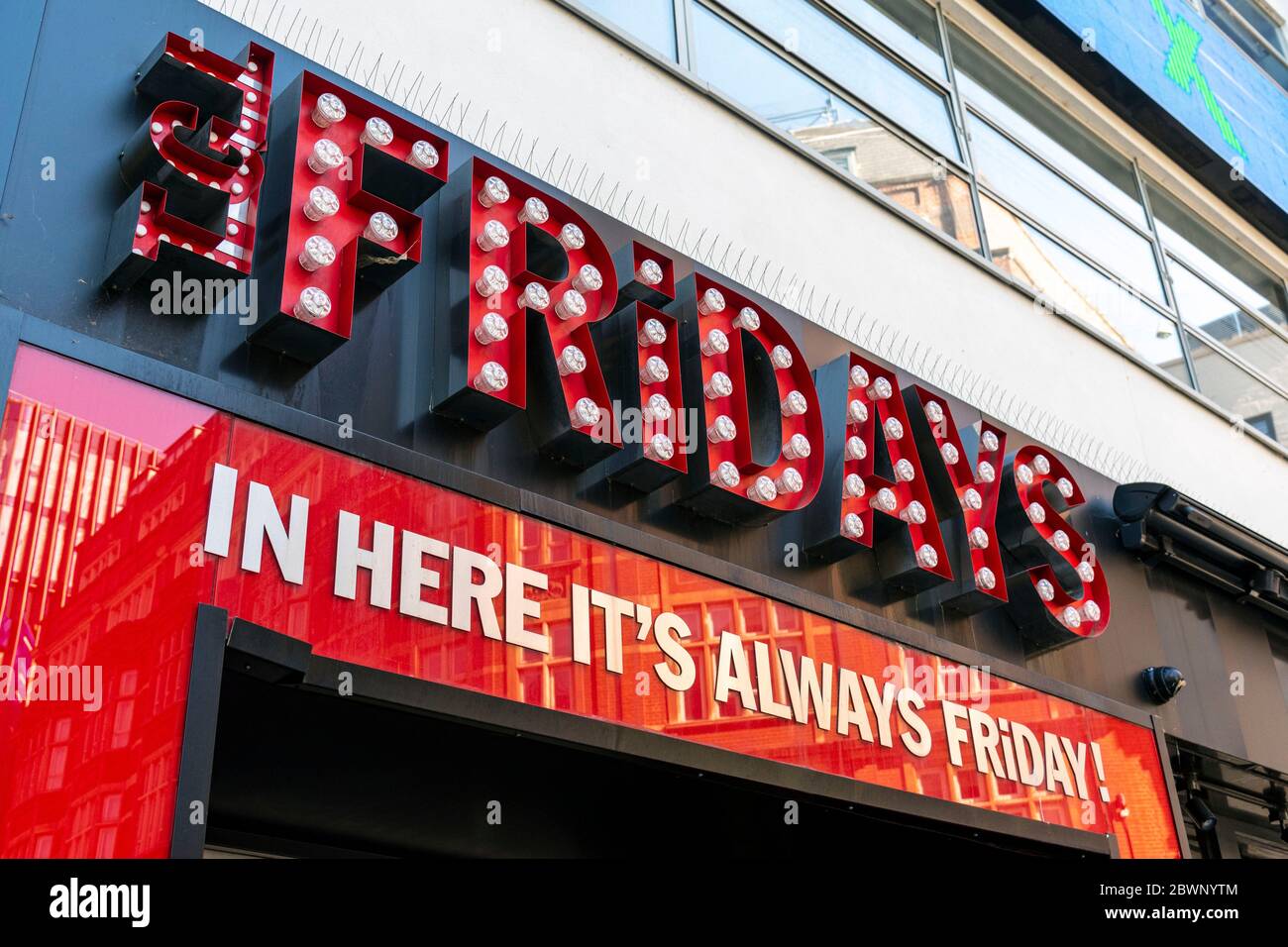 TGI Fridays logo and slogan on their restaurant in Leicester Square. Stock Photo