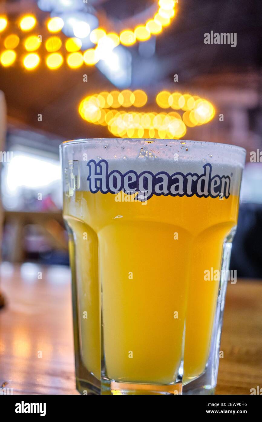 Belgrade / Serbia - November 17, 2019: Cup of Hoegaarden Belgian wheat beer on a table in a bar Stock Photo