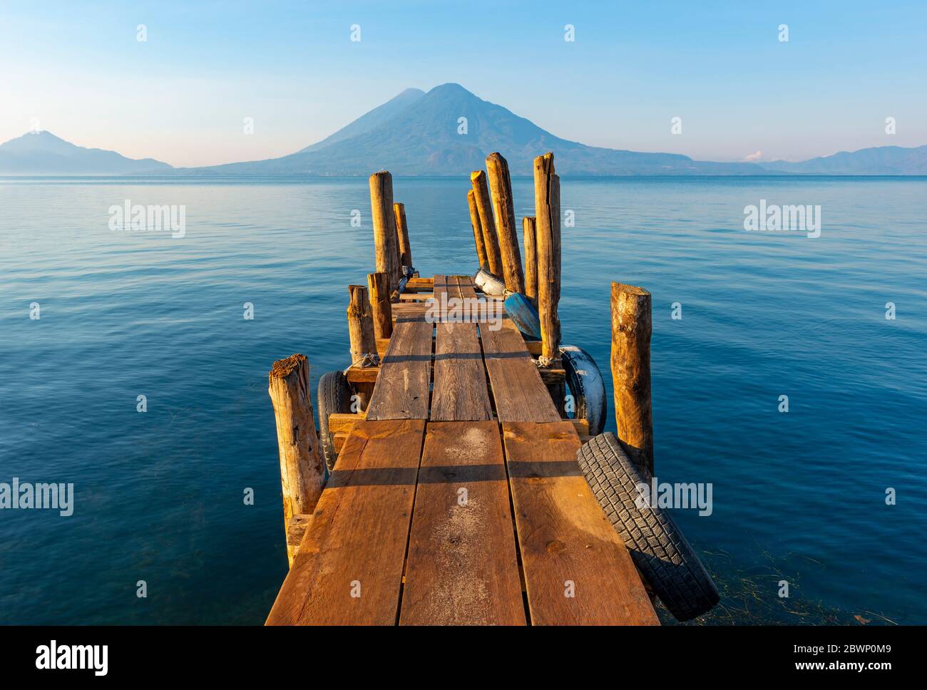 Sunrise by the Atitlan Lake with an embarkation pier, Panajachel, Guatemala. Stock Photo