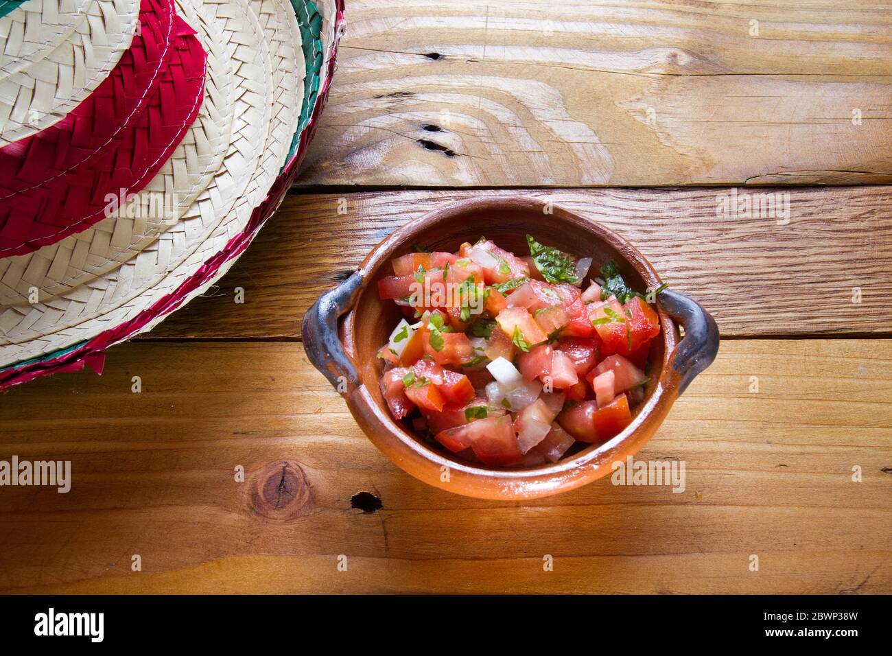 Traditional mexican salsa Pico de gallo and hat Stock Photo Alamy