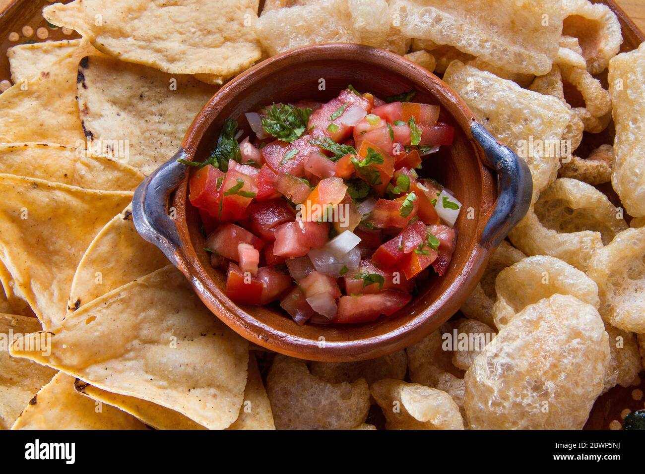 Traditional mexican sauce "pico de gallo" with tortilla chips and