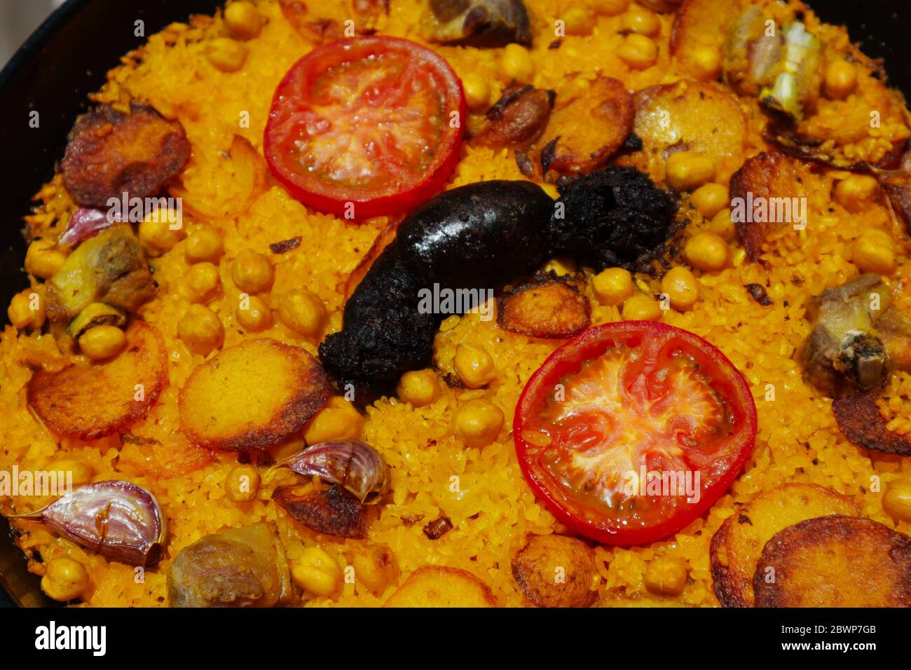 Close-up of a cooked baked rice casserole, typical dish from Valencia, Spain. Stock Photo