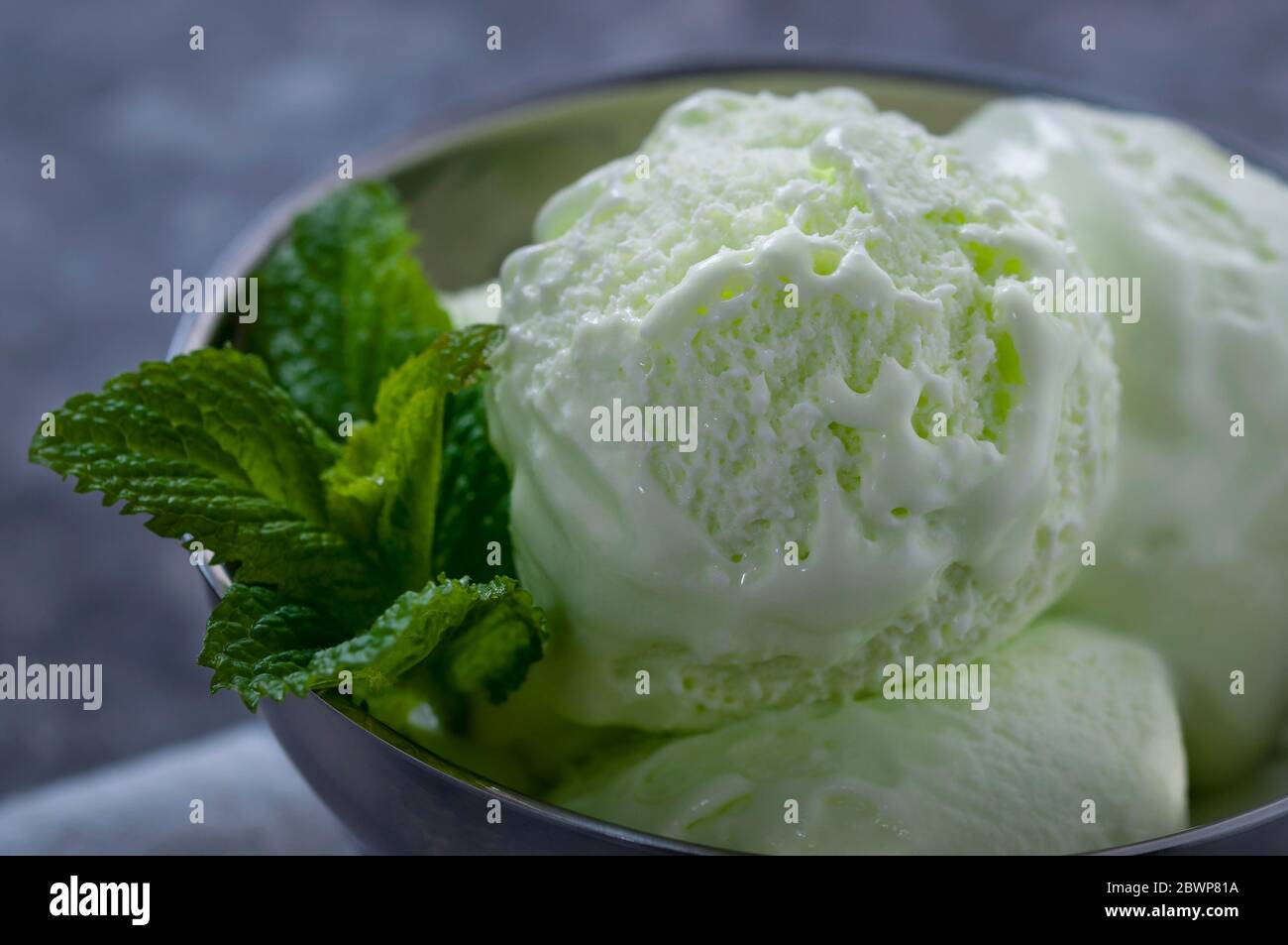 Cold summer dessert. Milk ice cream with kiwi. Ice cream fruit Stock