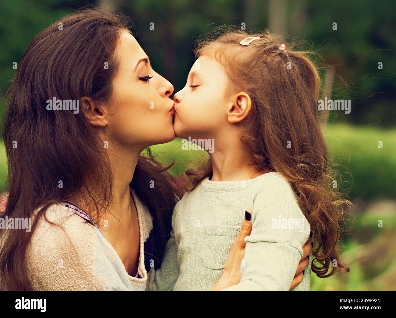 children kissing on the lips