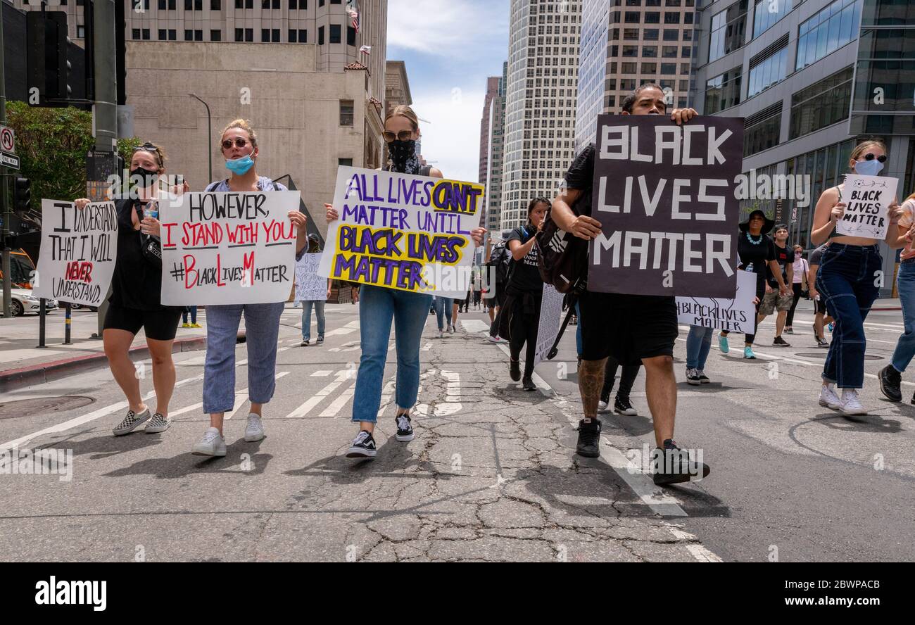 Los Angeles, USA, 3rd June, 2020. Protesters with signs march in honor of George Floyd Downtown. Credit: Jim Newberry/Alamy Live News. Stock Photo