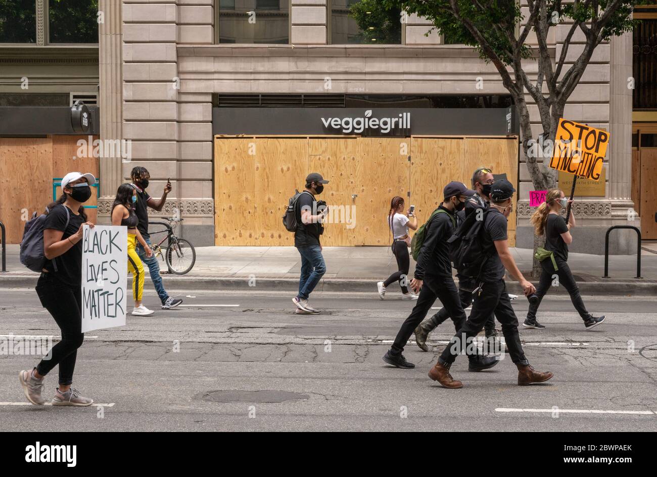 Los Angeles, USA, 3rd June, 2020. Protesters with signs march in honor of George Floyd Downtown. Credit: Jim Newberry/Alamy Live News. Stock Photo