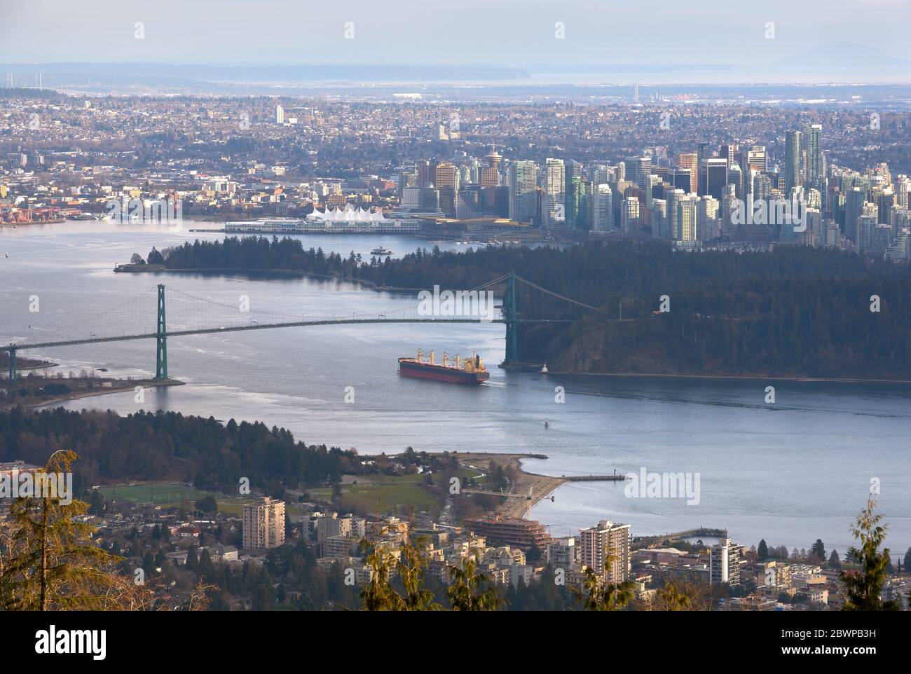 Vancouver Burrard Inlet Freighter and Cityscape. The view looking down over Burrard Inlet and downtown Vancouver. Stock Photo