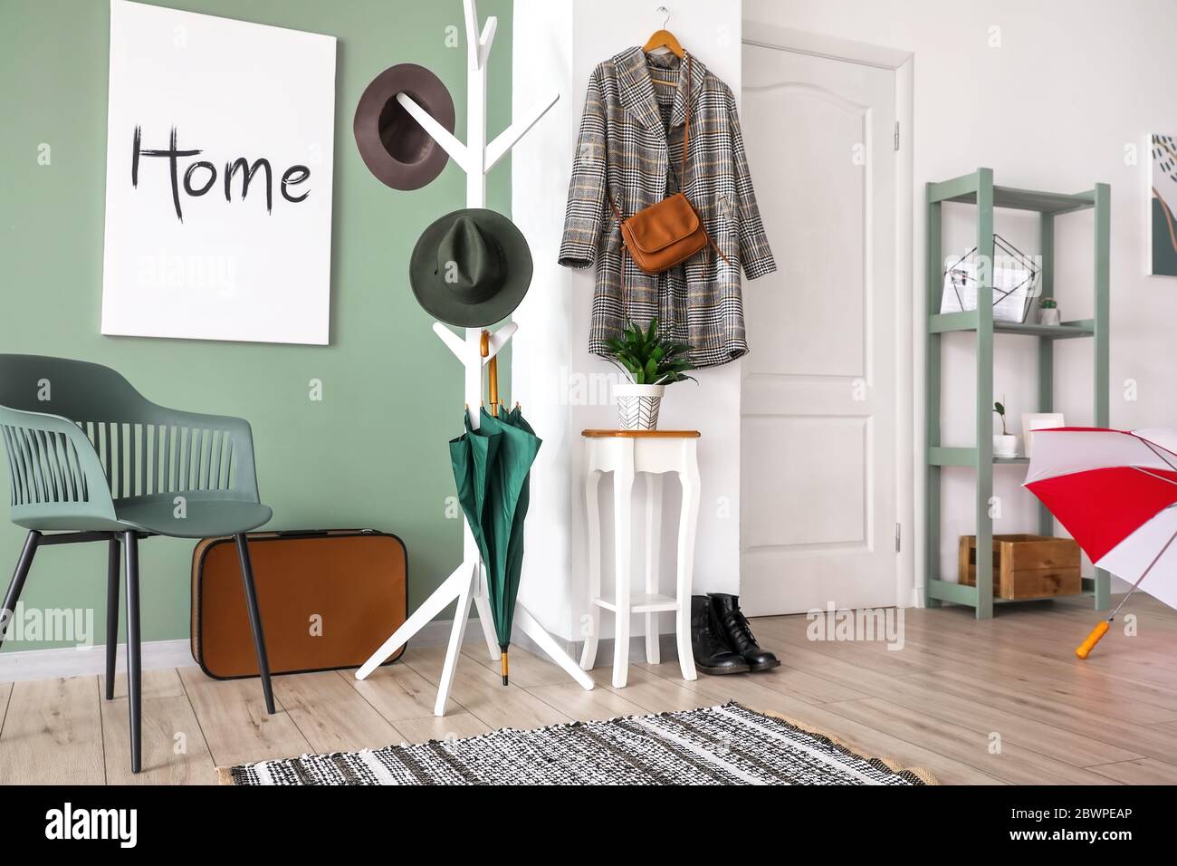 Stylish interior of modern hall with umbrellas and clothes hanger Stock Photo Alamy