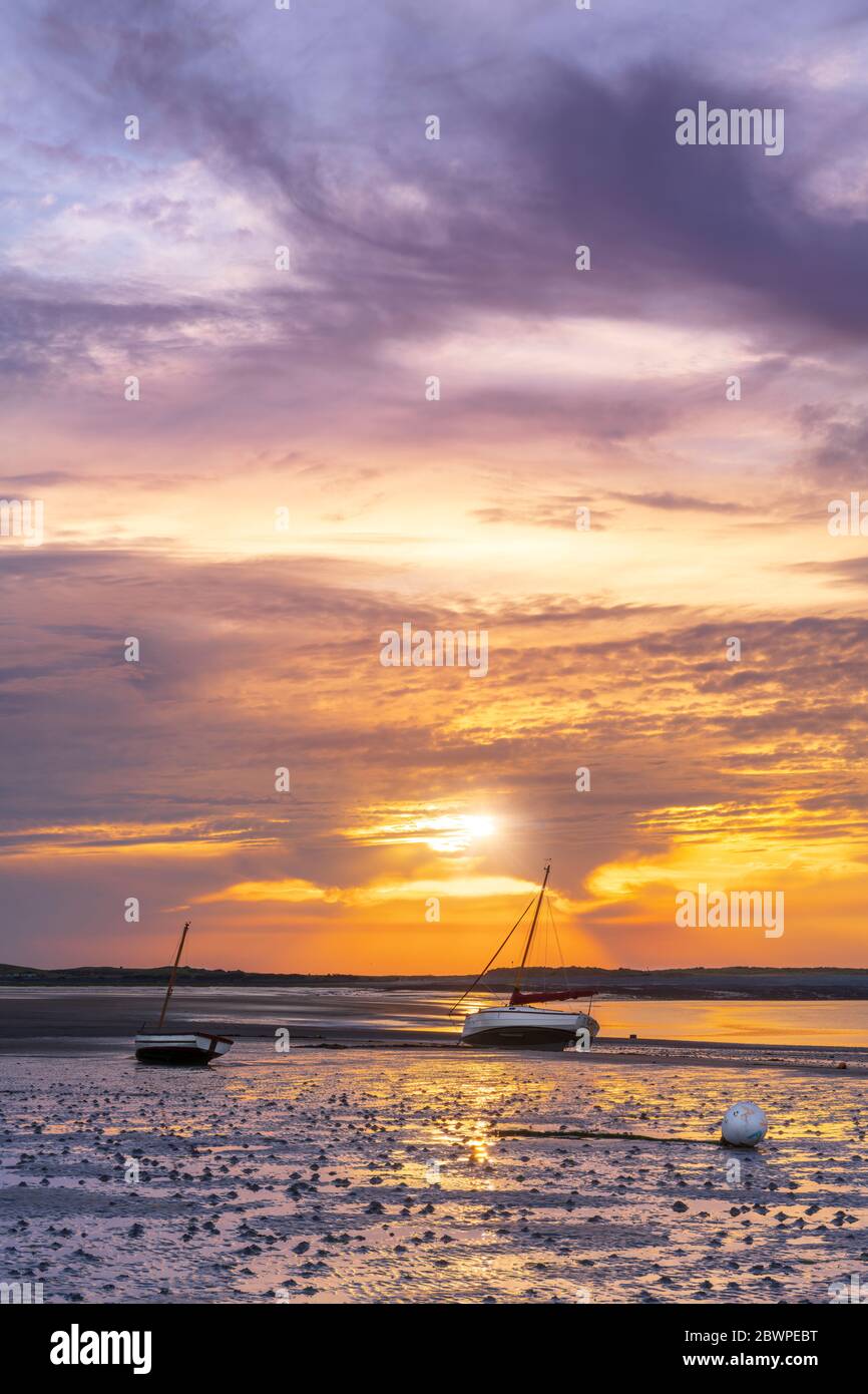 Appledore, North Devon, England. Tuesday 2nd June 2020. UK Weather. A beautiful end to the day on the River Torridge estuary as the sun sets behind Northam Burrows near Appledore in North Devon. A change is forecast for tomorrow with early showers and cooler temperatures.Terry Mathews/Alamy Live News. Credit: Terry Mathews/Alamy Live News Stock Photo