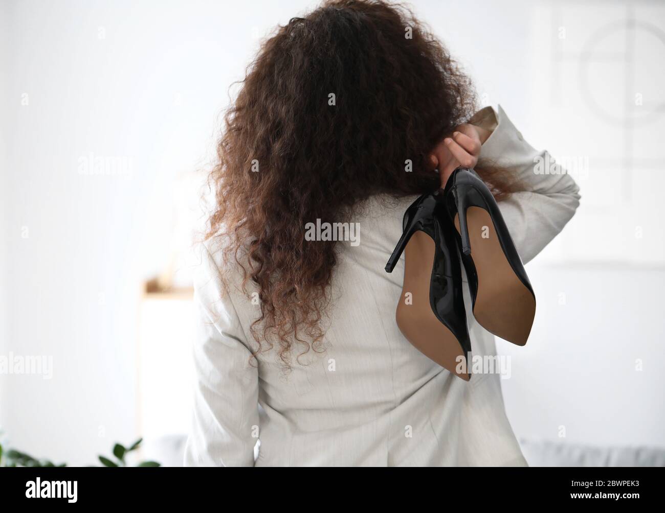 Businesswoman before weekends at home Stock Photo