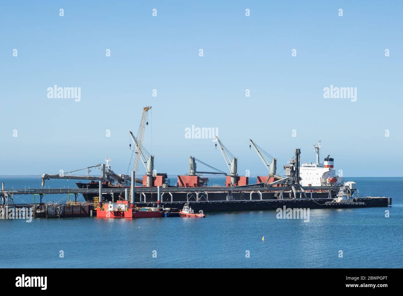 Thevenard South Australia November 17th 2019 : Container ship docked at the jetty port in Thevenard, South Australia Stock Photo