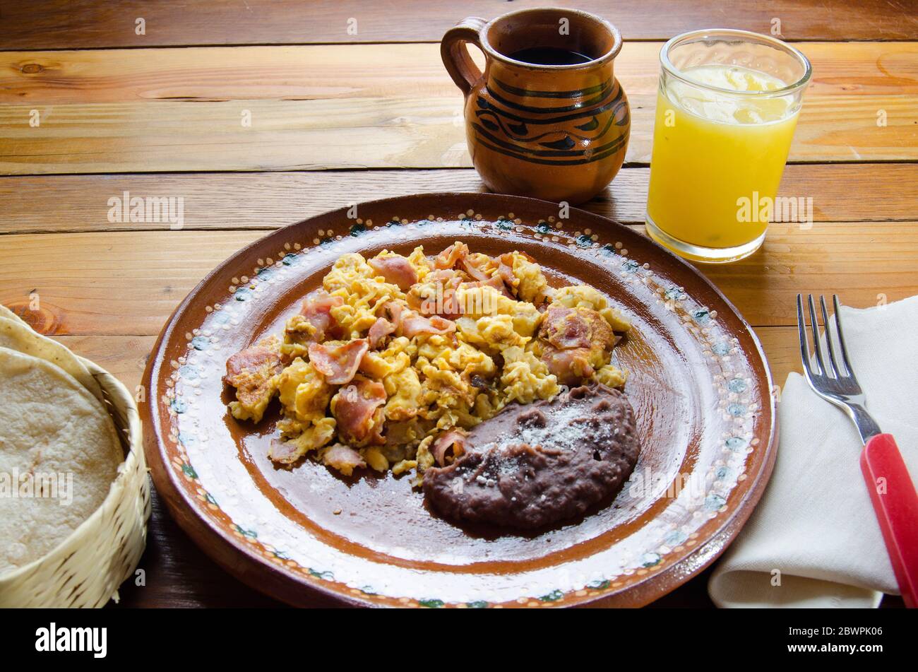 Mexican breakfast: Scrambled eggs with ham and beans Stock Photo - Alamy