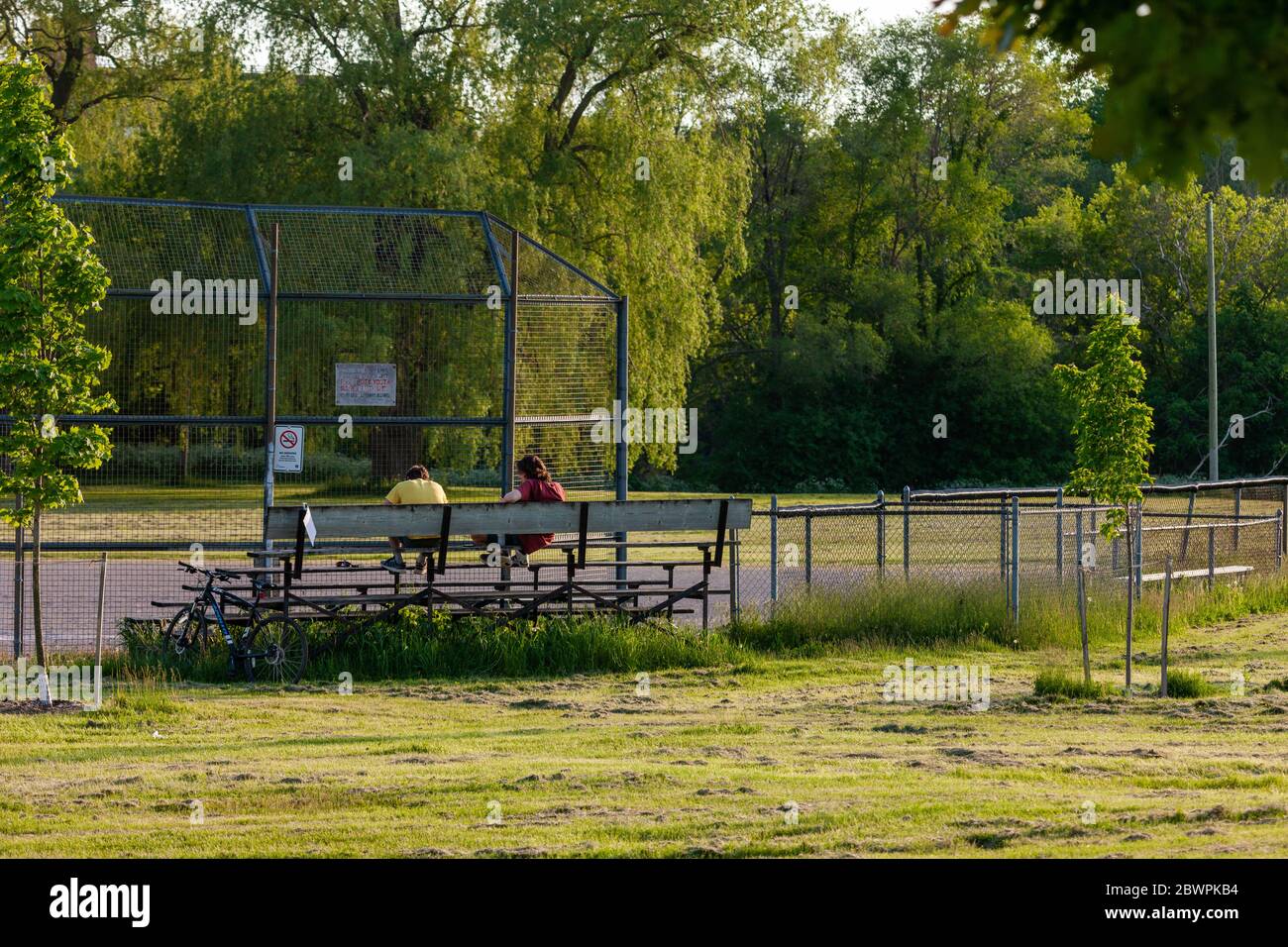 London, Canada - June 2, 2020. On any other warm summer night, baseball diamonds across the city would be busy till the sun goes down. In the age of COVID-19, they like many other places sit empty waiting for life to get back to normal. Mark Spowart/Alamy Live News Stock Photo