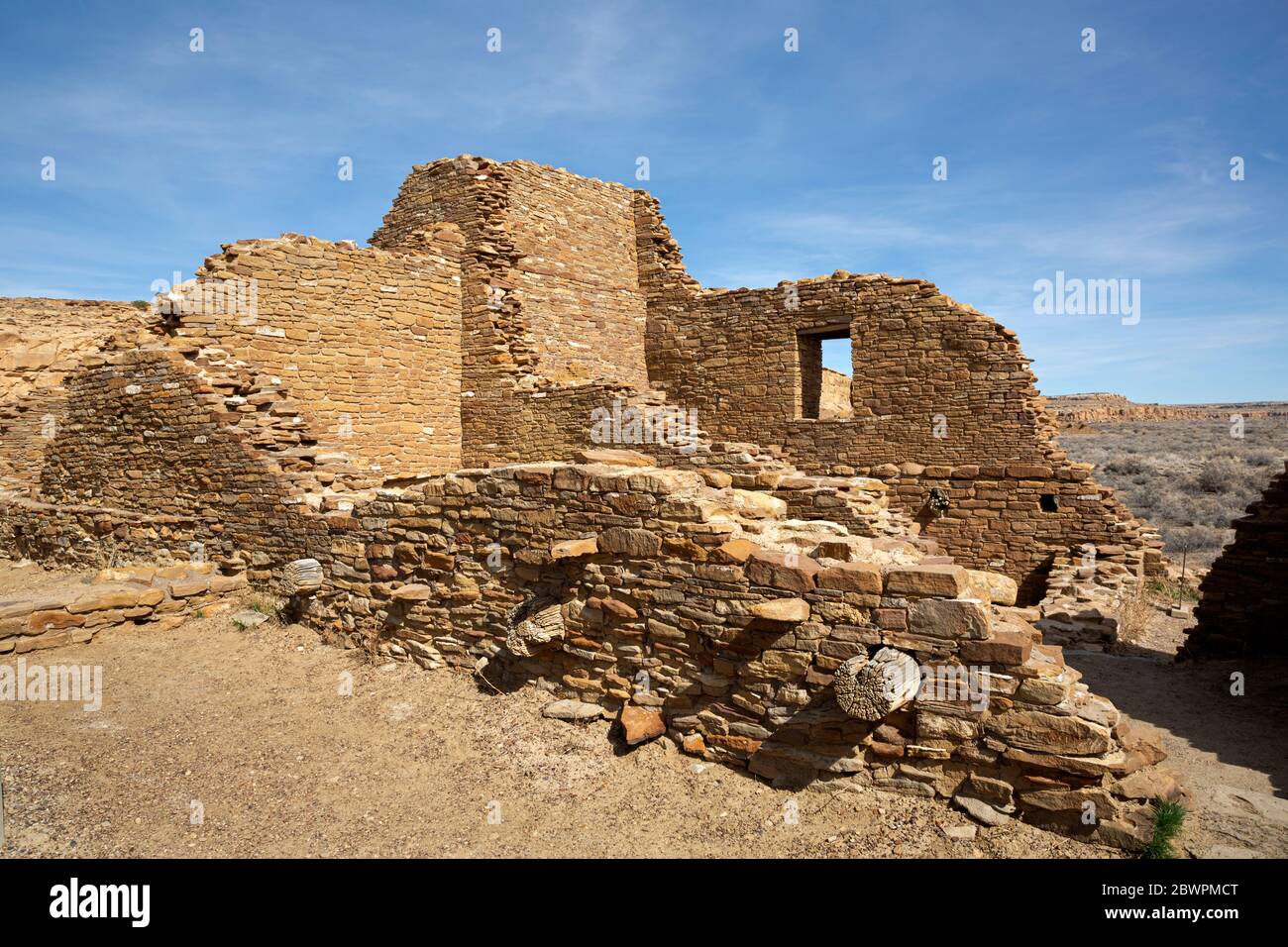 NM00395-00...NEW MEXICO - Walls with doors and log supports for floors in a multi-storied building at Pueblo del Arroyo in Chaco Culture National Park Stock Photo
