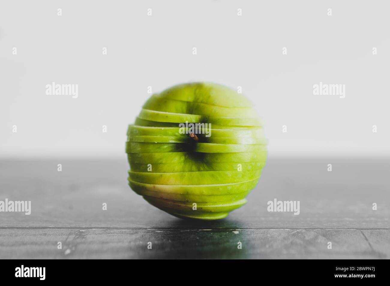 healthy-plant-based-food-ingredients-concept-green-apple-cut-into-thin