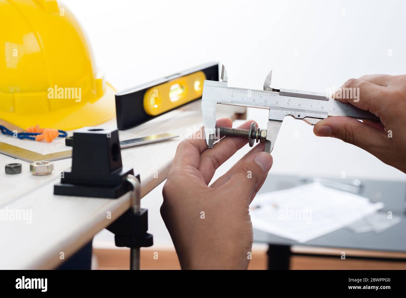 measuring the dimensions of part with metal vernier caliper, vernier