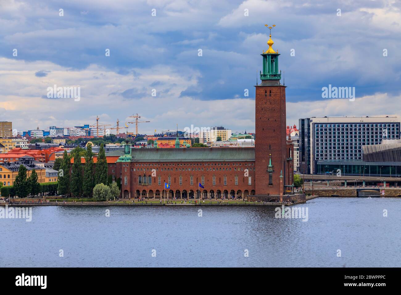 Stockholm, Sweden - August 11, 2017: View onto City Hall, Stadshuset, in Kungsholmen island and traditional gothic buildings in old town Stock Photo