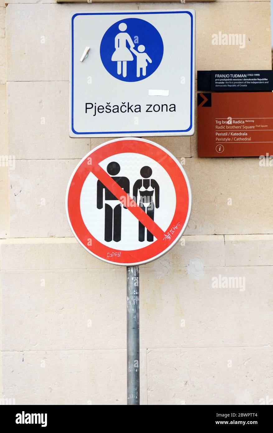 No entry with bathing suits aloud warning sign. Stock Photo