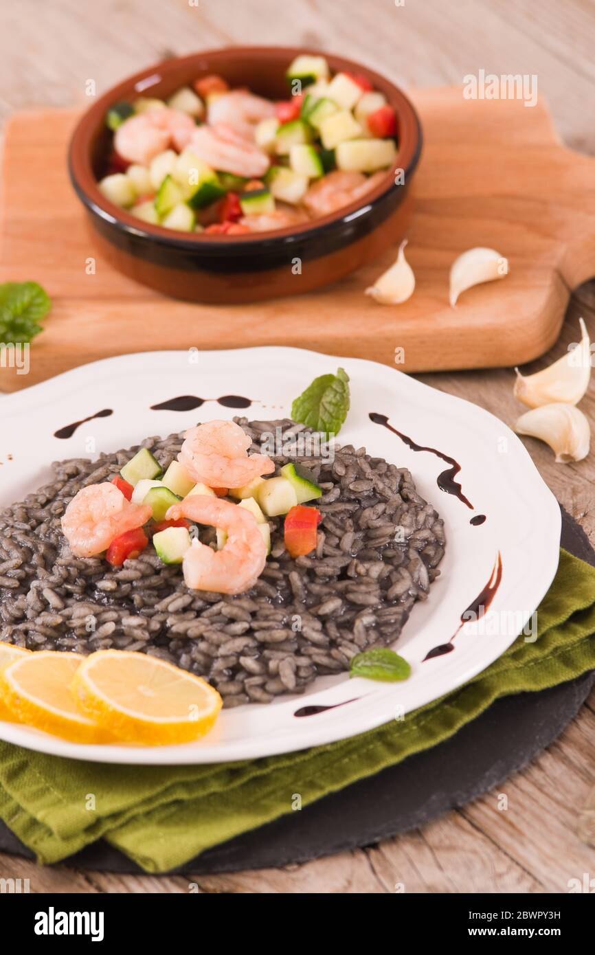 Squid ink risotto Stock Photo - Alamy