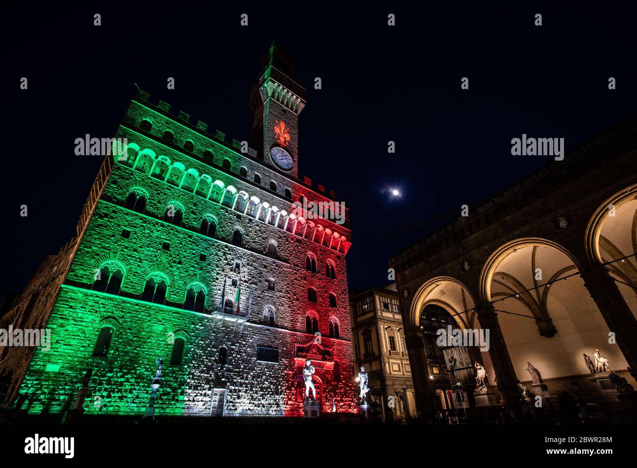 Florence, FI, Italy. 2nd June, 2020. Palazzo Vecchio illuminated with the colors of the Italian flag, on the occasion of the Republic Day. ''A symbolic gesture - declares the Mayor of Florence Dario Nardella - to give a signal of hope and confidence in the rebirth of our city and of Italy' Credit: Marco Pasquini/ZUMA Wire/Alamy Live News Stock Photo