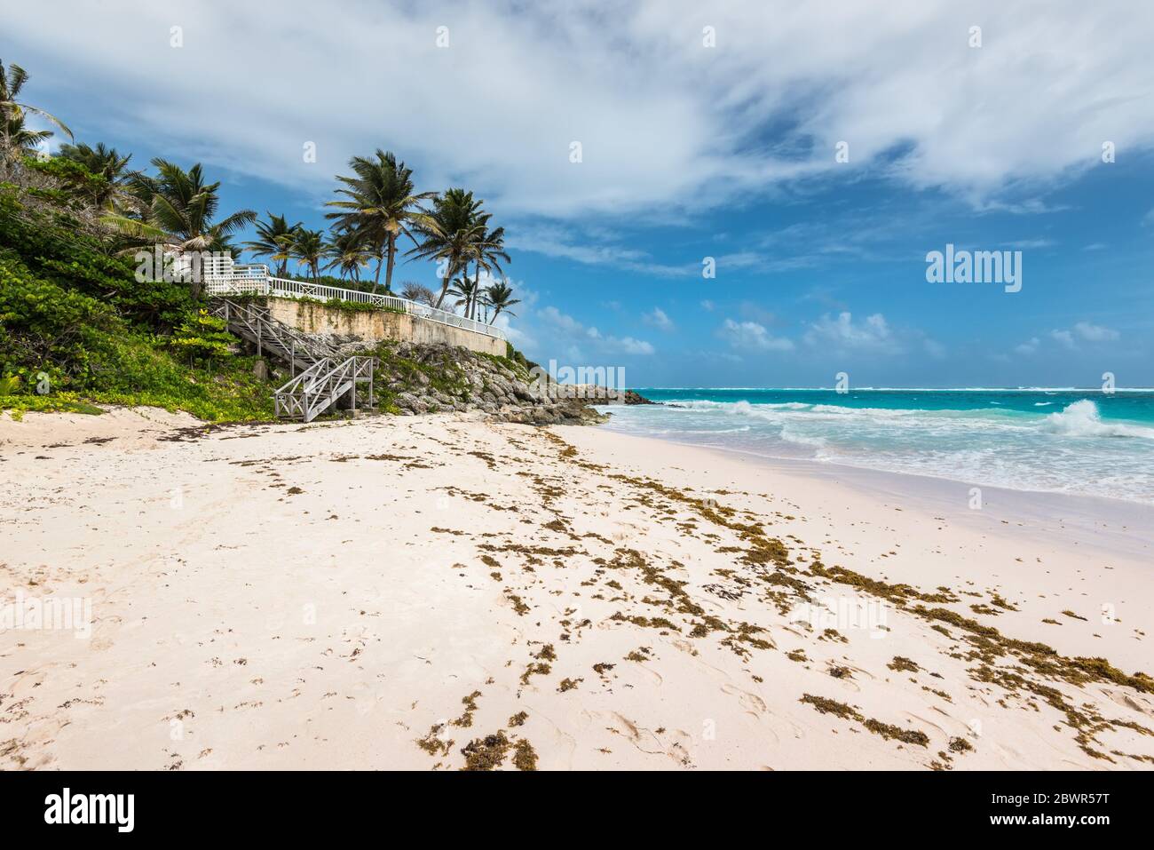 Tropical Crane Beach in Barbados island in cloudy weather West Indies, Caribbean. The beach