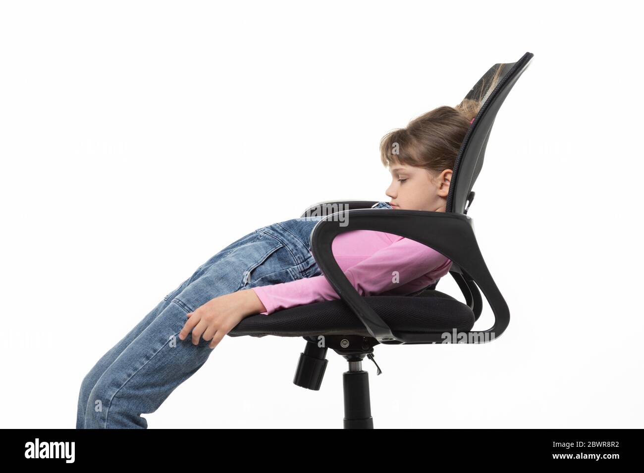 Girl Funny Lay Down In An Office Chair Stock Photo Alamy