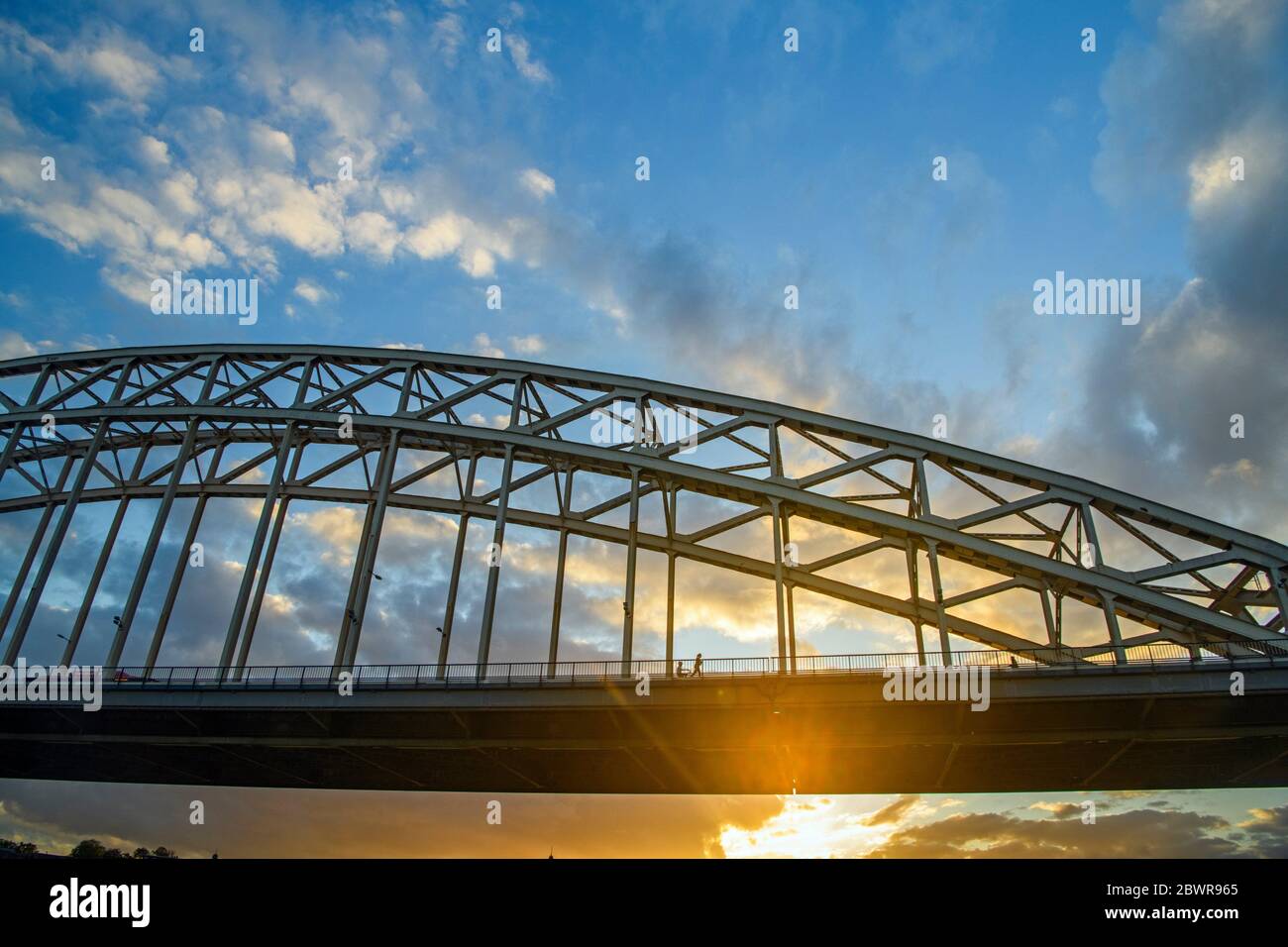 Waalbrug Bridge over the Waal River at sunset, Nijmegen, Gelderland, Netherlands. Stock Photo