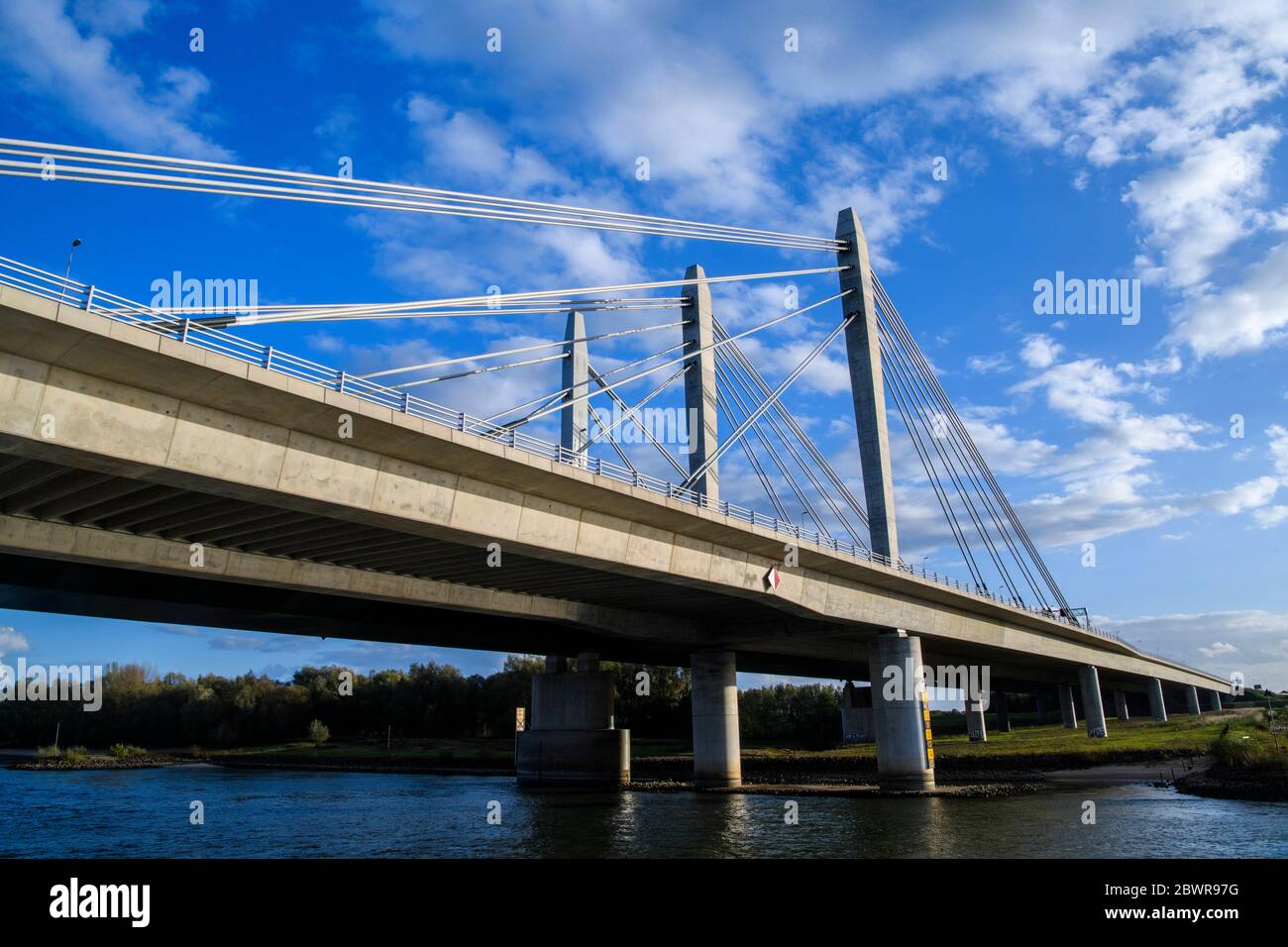 Ewijk-bridge - a suspension bridge over the Waal River, Ewijk, Gelderland, Netherlands. Stock Photo