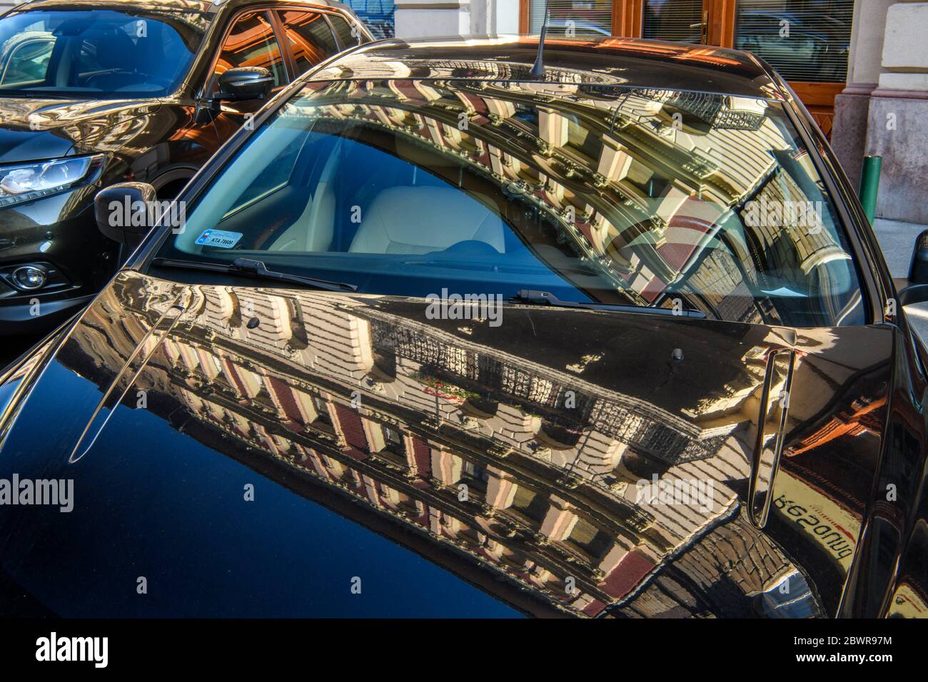 Downtown Budapest (Pest)- reflections in parked cars, Budapest, Central Hungary, Hungary. Stock Photo