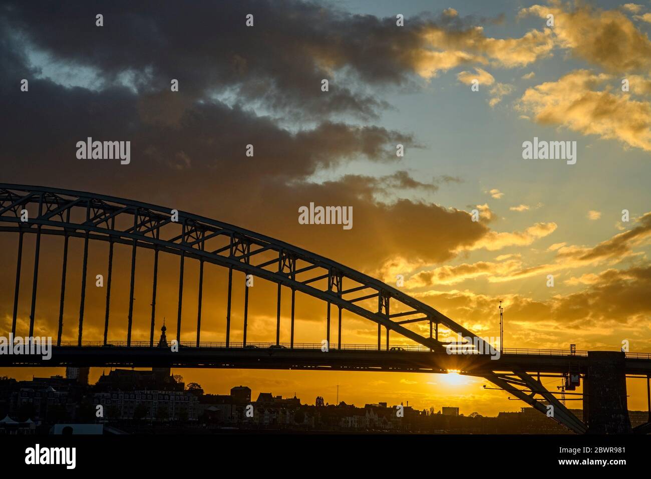 Waalbrug Bridge over the Waal River at sunset, Nijmegen, Gelderland, Netherlands. Stock Photo