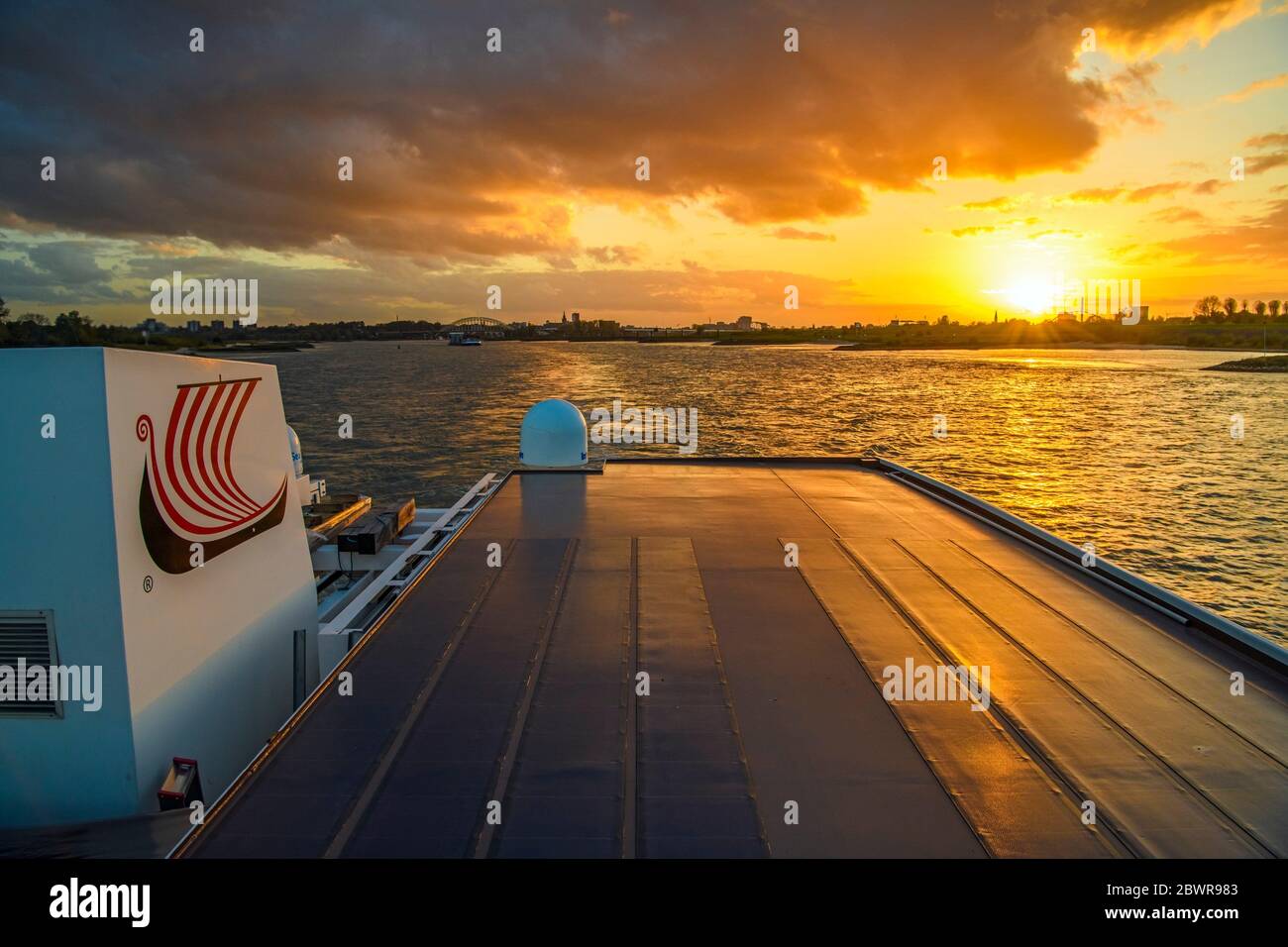 Sunset over the Waal River from the upper deck of the Viking Ve river cruiser, Nijmegen, Gelderland, Netherlands. Stock Photo