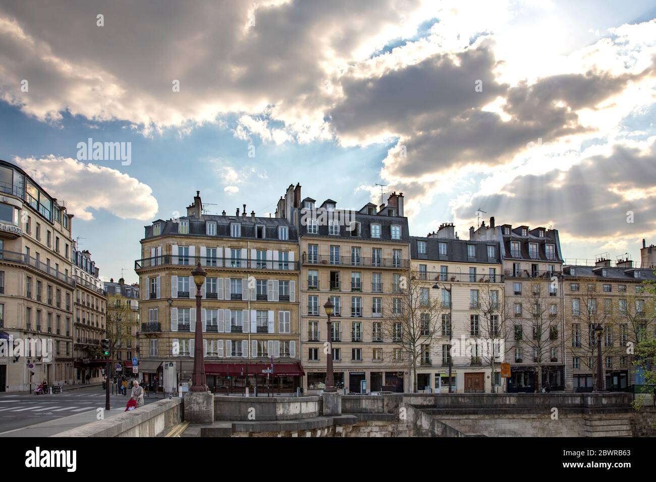 Paris, France - April 9, 2020: Typical Haussmannian buildings near La Tour D'Argent restaurant during containment due to covid-19 Stock Photo