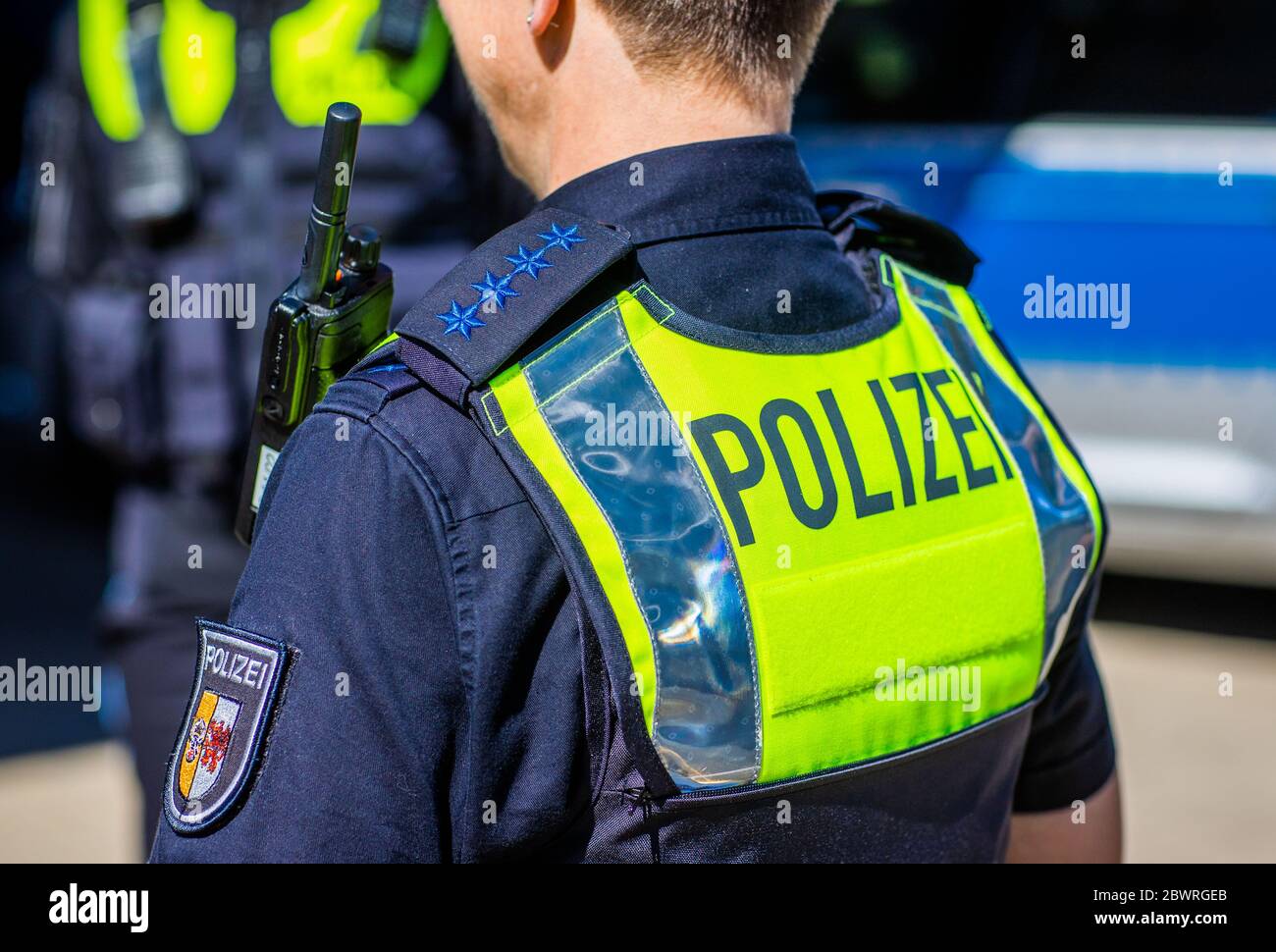 Schwerin, Germany. 28th May, 2020. Police officers wear the new overt vests  for equipment, which were officially presented by the  Mecklenburg-Vorpommern state police, at a photo session. The so-called  