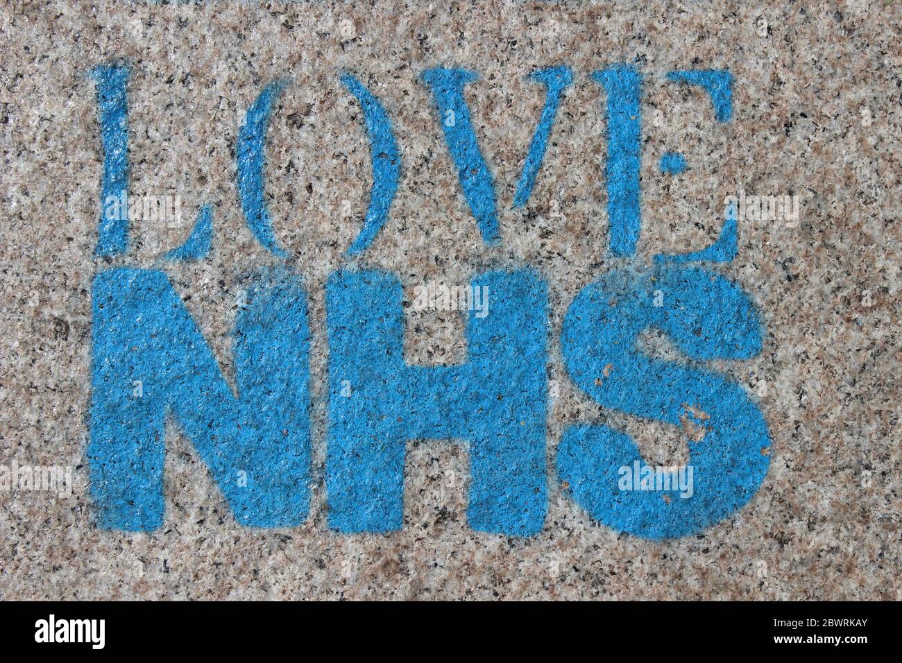 Love NHS - stencil art on pavement, Liverpool, UK Stock Photo