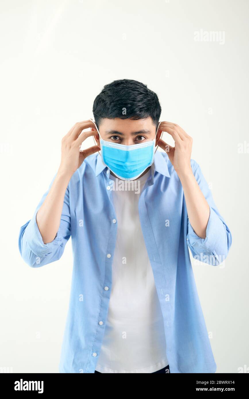 Man wearing an anti virus protection mask to prevent others from corona COVID-19 and SARS cov 2 infection Stock Photo