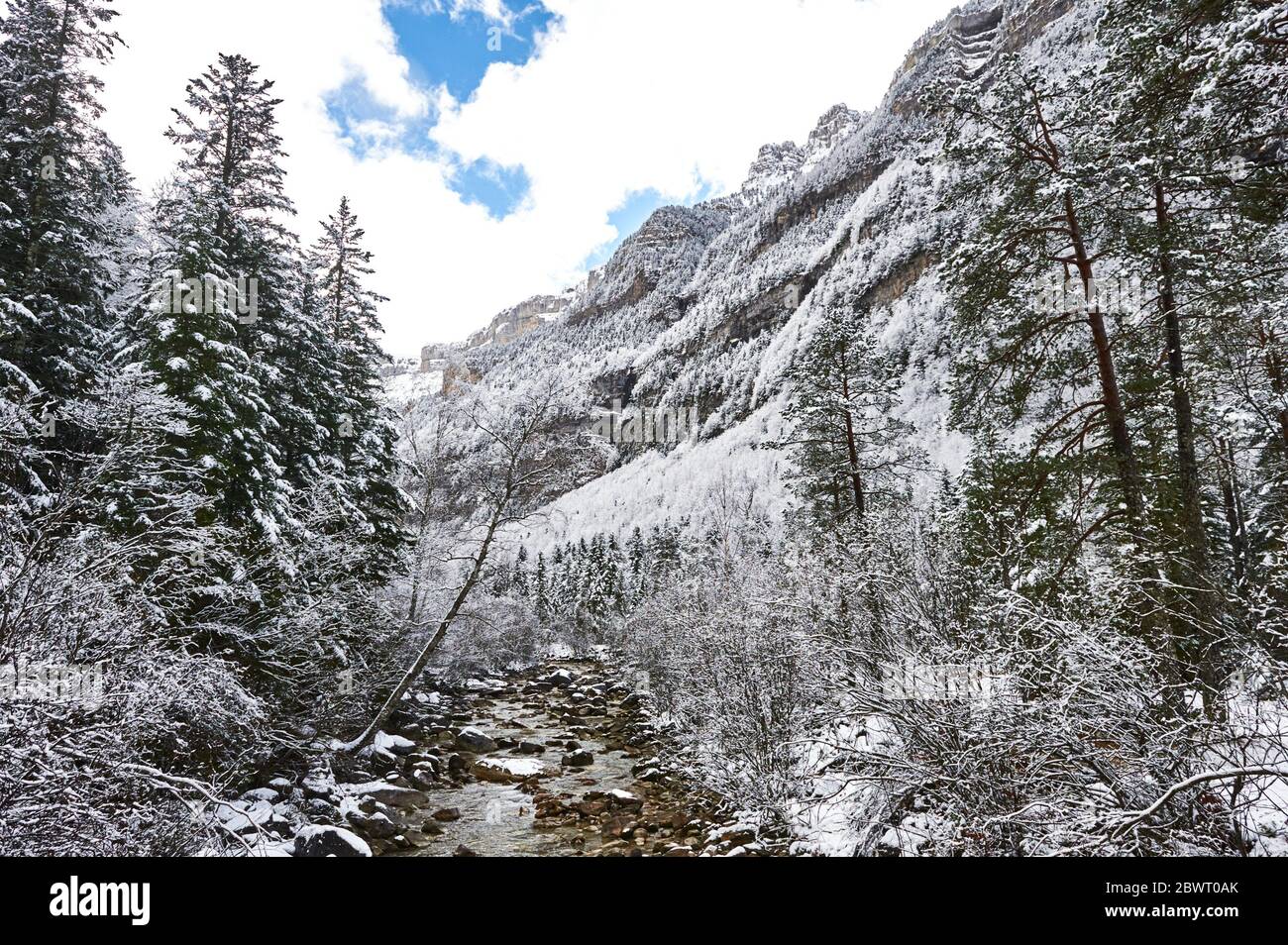 Pyrenees: Arazas river along snowy alpine landscape in the National park of Ordesa and Monte Perdido (Huesca province, Aragon region, Spain) Stock Photo