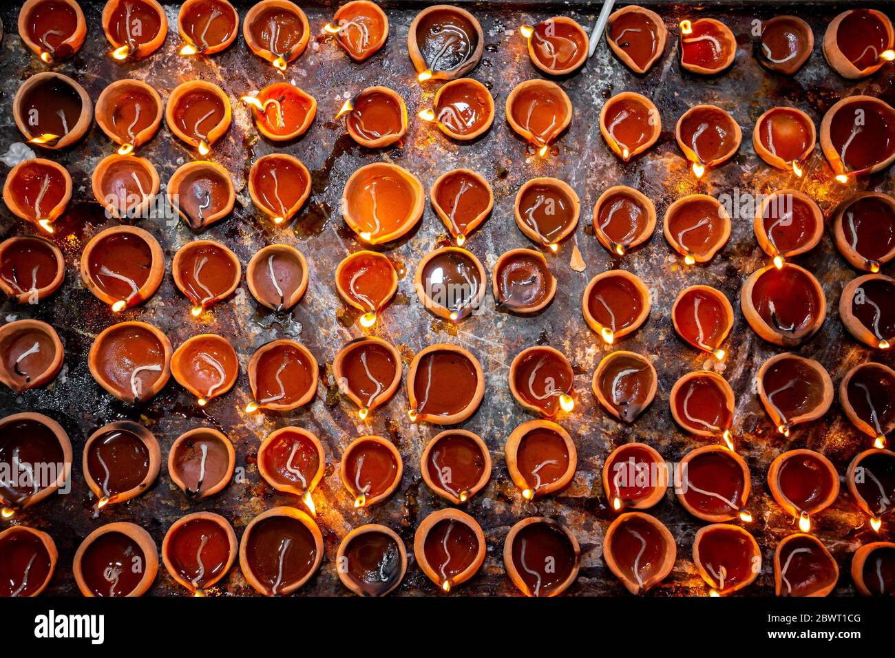 Numerous Clay oil lamps are burning. Traditional festival of oil lamp symbolizing spreading of