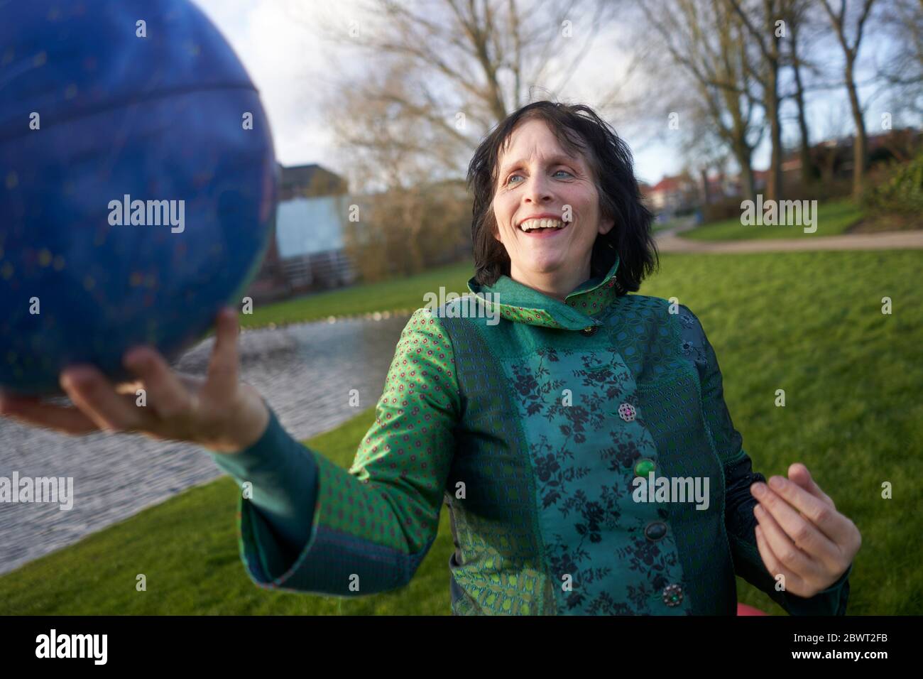 Woman with astrological star map globe. Leeuwarden, Netherlands. Stock Photo