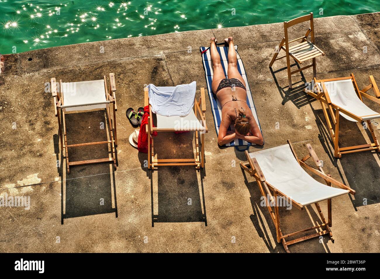 sunning by the Club Nautico, San Sebastian or Donostia, Basque Region,  Spain Stock Photo - Alamy