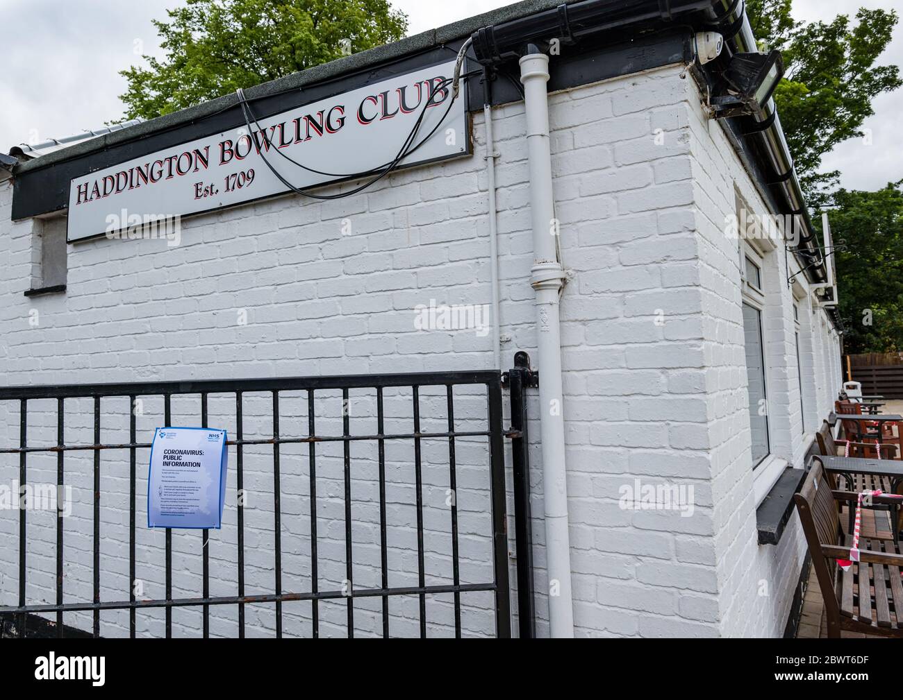 Haddington, East Lothian, Scotland, UK, 03 June 2020. Scotland's oldest bowling club prepares to reopen today after lockdown restrictions are eased with social distancing notices around the clubhouse Stock Photo