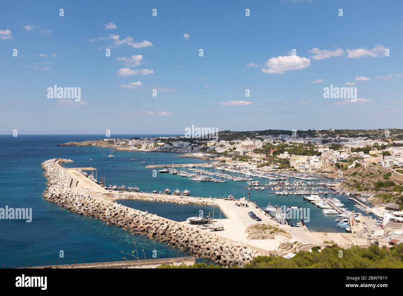 We are in southern Italy in Santa Maria di Leuca, Finibus Terrae, where the Italian peninsula ends, seen from the top of the marina with boats moored. Stock Photo