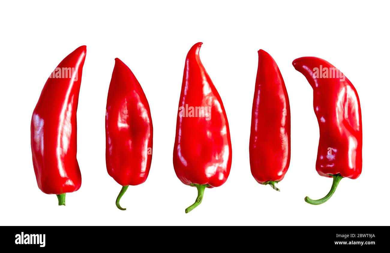 Isolated fve whole red sweet fresh bell peppers on a white background Stock Photo