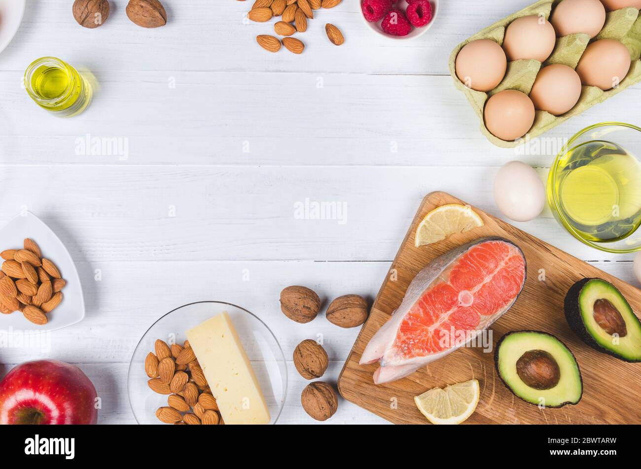 Keto diet, low carb healthy food (avocado, fish, eggs, oil, nuts