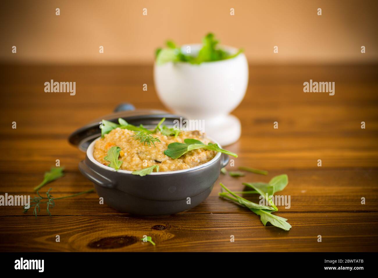 boiled bulgur groats with vegetables and herbs Stock Photo
