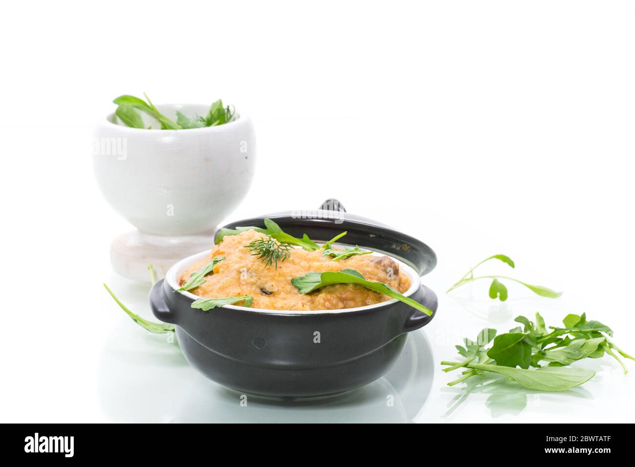 boiled bulgur groats with vegetables and herbs Stock Photo