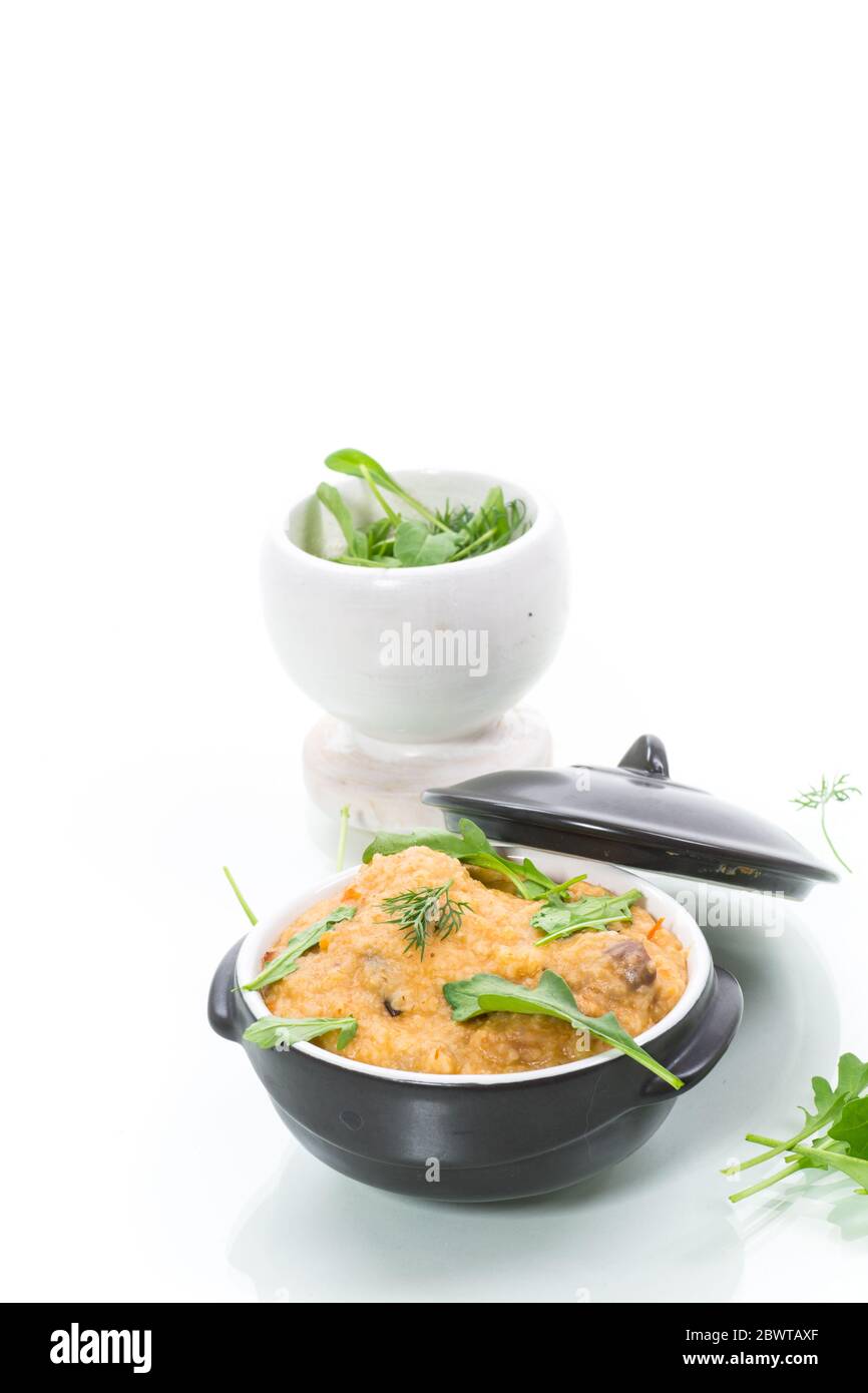 boiled bulgur groats with vegetables and herbs Stock Photo